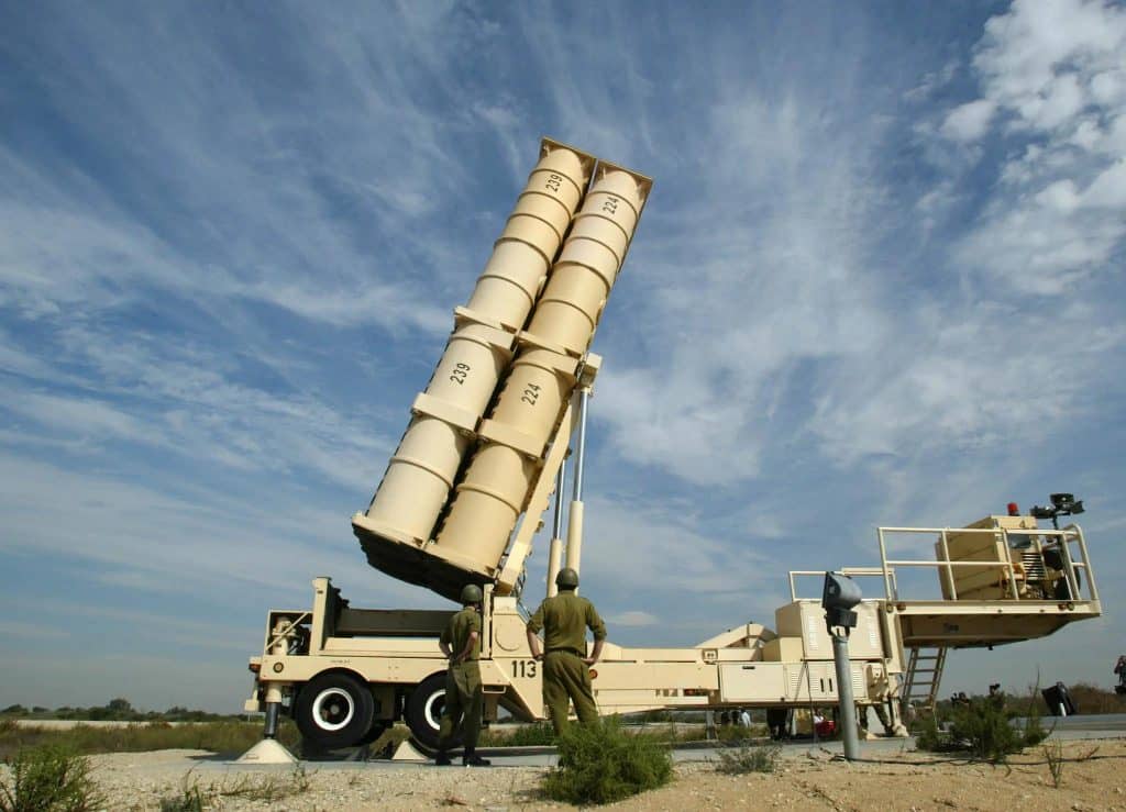An Arrow missile launcher with soldiers who watch the missile launcher