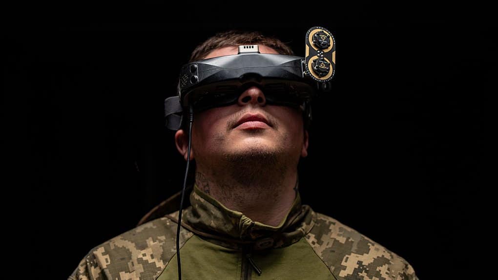 A Ukrainian soldier controls an FPV drone from an overcast area in the Donetsk region.