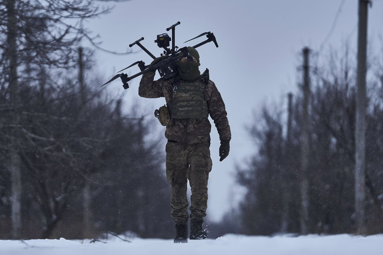 A Ukrainian soldier carries a drone close to the front line near Avdiivka, Donetsk region, Ukraine, on February 17, 2023.