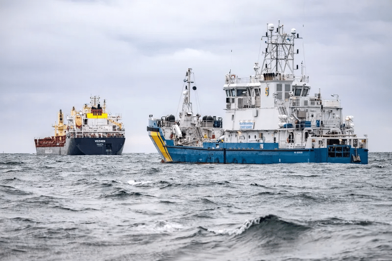 Swedish Coast Guard vessel KBV 033 and the cargo ship Vezhen, suspected of having sabotaged a fiber-optic cable in the Baltic Sea, sit anchored off Karlskrona, Sweden, on Jan. 27